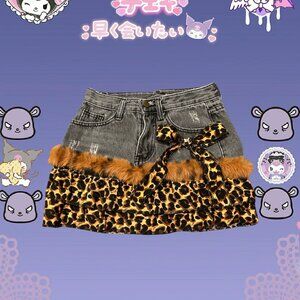 Super cute and unique black and tan denim short with faux fur lining and bow